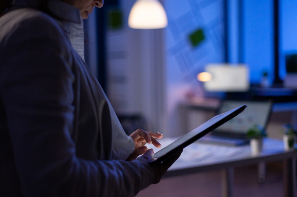 Executive Using Digital Tablet for AI Business Insights